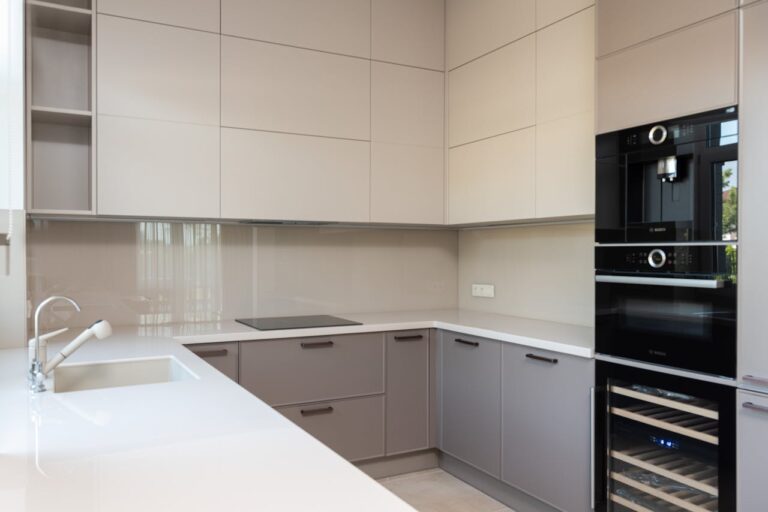 A modern kitchen highlighting sleek cabinetry and contemporary appliances, perfect for urban living.